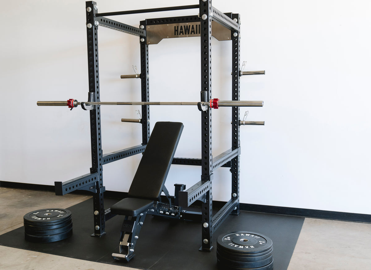 Hawaii power cage with adjustable bench, barbell and bumper plates